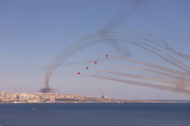 Baku. Azerbaijan. 05.06.2022. Red striped fighters in the air. Technical festival.
