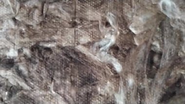 Mineral yün lifleri kapanıyor. İnşaatta mineral yünü. Yalıtım. İnşaat ve inşaat malzemeleri.