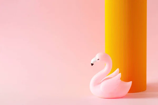 Cosmetic, summer and fashion template pink background with orange part and flamingo, minimalism