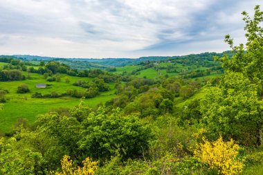 Panorama of the village and the verdant landscapes around Salins in the Cantal