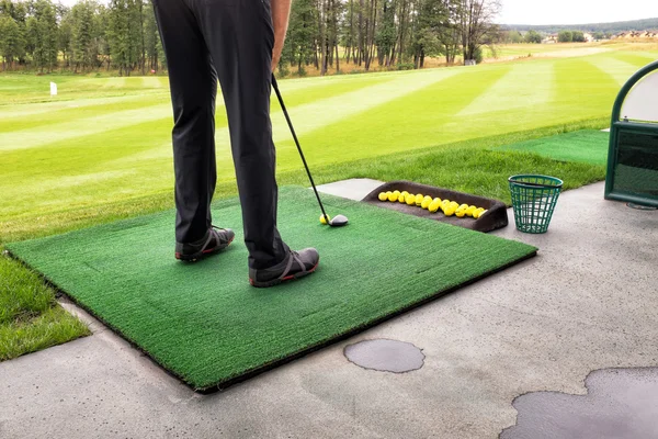 Playing golf on a golf course in cloudy weather — Stock Photo, Image