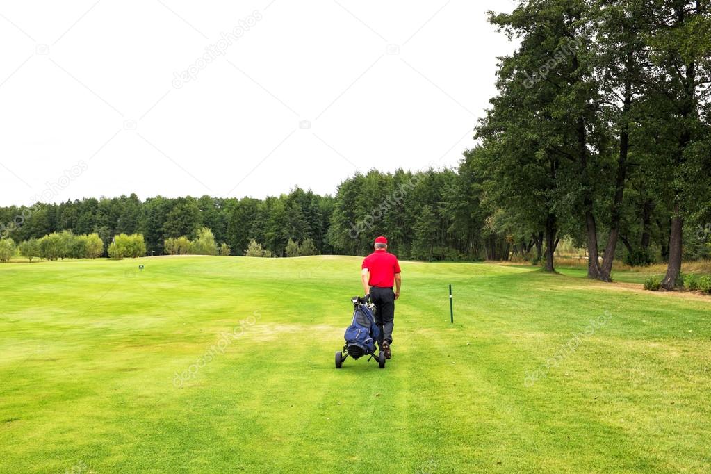 playing golf on a golf course in cloudy weather