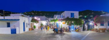 Paros, Greece 02 August 2016. People enjoying their summer vacations at Lefkes village in Paros island in Greece. clipart