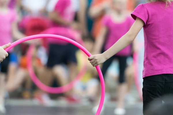 Hula hoop exercises at school. — Stock Photo, Image