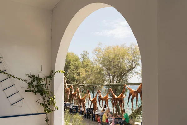 Athens, Greece 13 August 2015. Traditional Greek food octopus hanging outside a Greek tavern at Paros island in Greece. — Stock Photo, Image