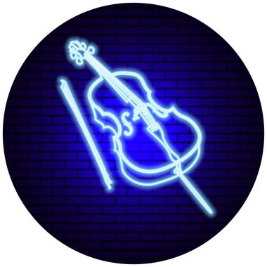 Tuğla duvara karşı neon ışıklı bir çello.