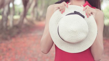 white hat with red dess