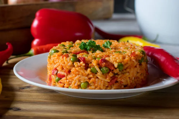 mediterranen rice dish cooked with ayvar, red peppers and green peas. Serbian djuvec rice