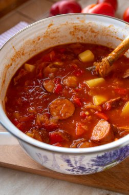 Sauerkraut Soup with sausage fresh and homemade cooked in a pot