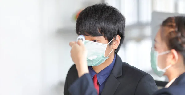 Male Staff Wearing Medical Face Mask Checking Fever His Colleague — Stock Photo, Image