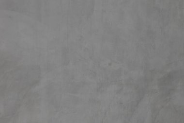 Soyut arkaplan ve tasarım amacı için doğal dokusuna sahip koyu gri beton duvar.