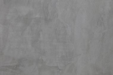 Soyut arkaplan ve tasarım amacı için doğal dokusuna sahip koyu gri beton duvar.