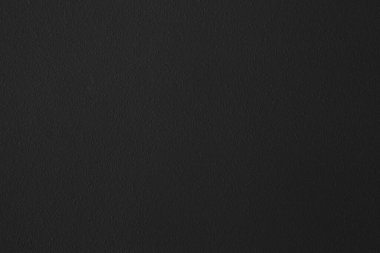 Soyut arkaplan ve tasarım amacı için doğal dokuya sahip koyu siyah beton duvar.