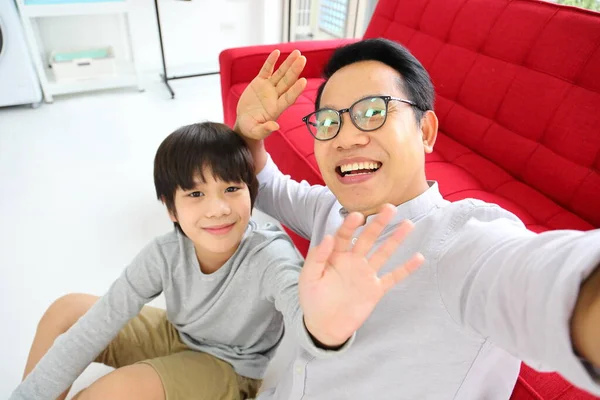 Asian Father Son Waving Hand Camera Video Call Online Internet — Stock Photo, Image