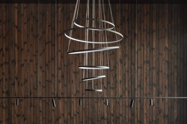 Modern led Pendant light lamp against wood wall, Elegant spiral ceiling Chandelier. Contemporary interior concep