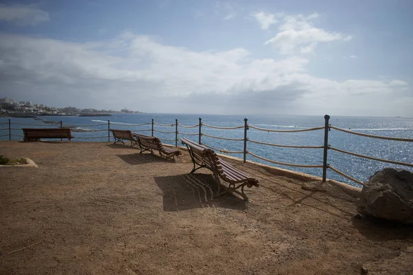 Landscape with benches on the edge of the island