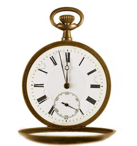 Golden ancient pocket watch marking few minutes to midnight opened against white background.