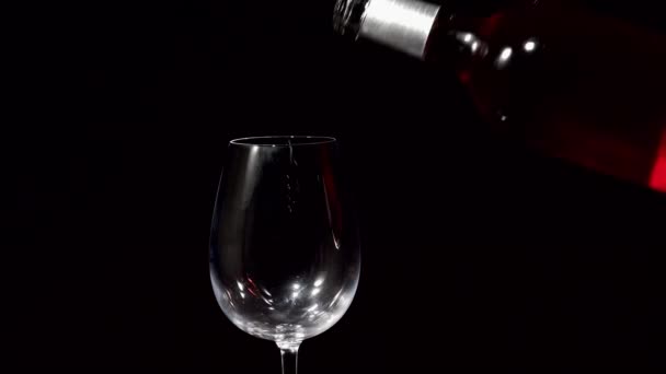 Pink wine flowing into glass — Stock Video