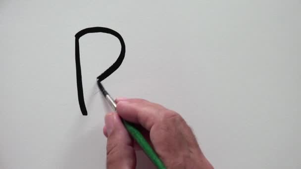 Menselijke hand schrijven "Paw" met zwarte inkt — Stockvideo