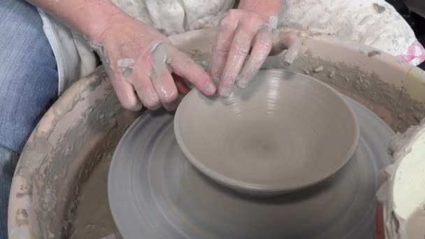 Potter working with clay on a lathe — Stock Video