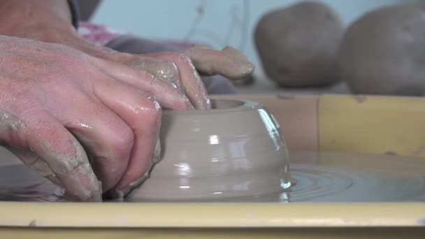 Potter working with clay on a lathe — Stock Video