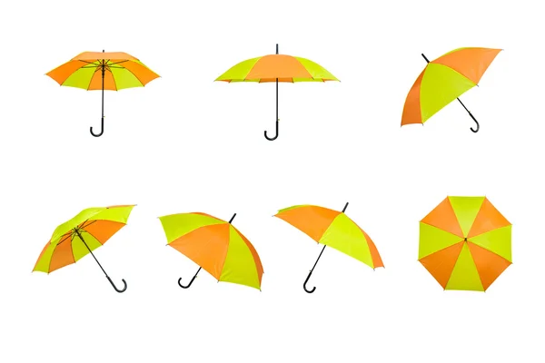 Guarda-chuva amarelo e laranja sobre um fundo branco — Fotografia de Stock