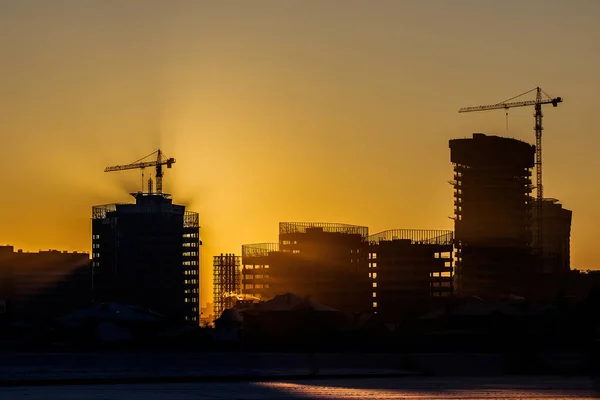 stock image City construction site in the rays of the setting sun