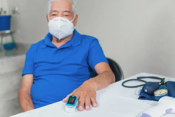 older man on medical check-up in a clinic