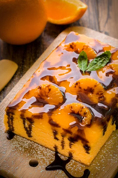Orange Cake on Wooden Plate — Stock Photo, Image