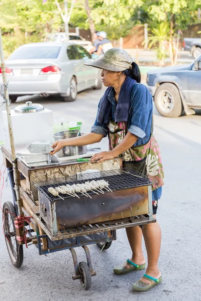 BANGKOK, THAILAND - JUNE 6, 2015: Street Food Vendor Cart Selling Grilled Pork Ball. This Kind of mobile kitchen is very popular in Thailand and can be found almost everywhere. — Stock Photo, Image