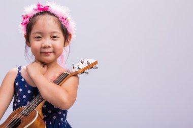 Child with Music Instrument Ukulele