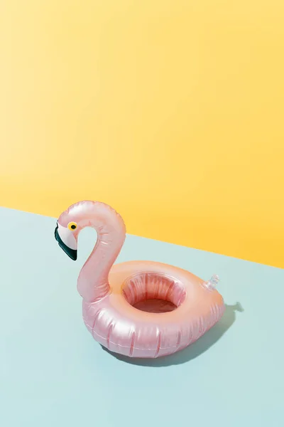 Pink Flamingo Shaped Inflatable Blue Yellow Background Summer Holiday Travel — Stok fotoğraf