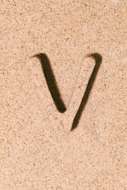 Letter V of the sand isolated on the beach sand.Illustration 3d. concept of summer. alphabet.