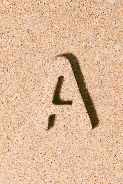 Letter A of the sand isolated on the beach sand. concept of summer. alphabet.