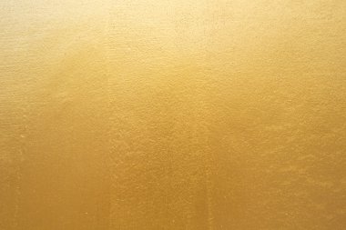 Beton duvara altın arka plan dokusu.