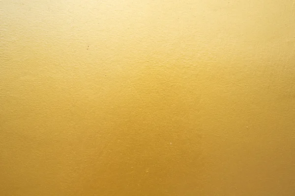 Beton duvara altın arka plan dokusu. — Stok fotoğraf