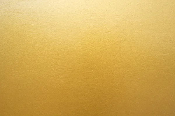 Beton duvara altın arka plan dokusu. — Stok fotoğraf