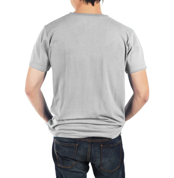 Close-up van de mens in terug licht grijs shirt op witte achtergrond. — Stockfoto