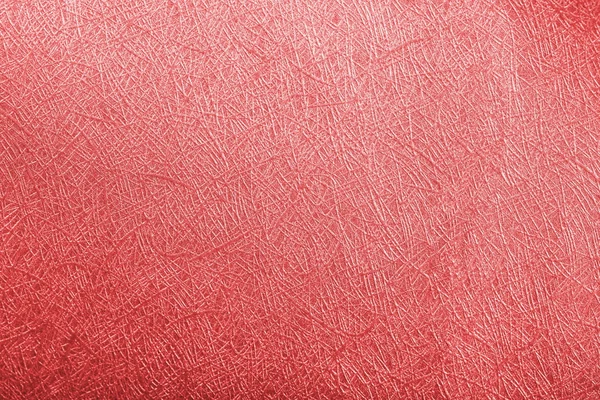 Red paper foil on background texture.