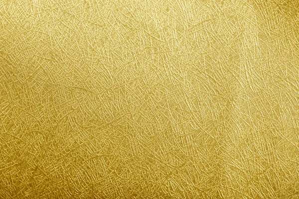Golden paper foil on background texture. — Stock Photo, Image