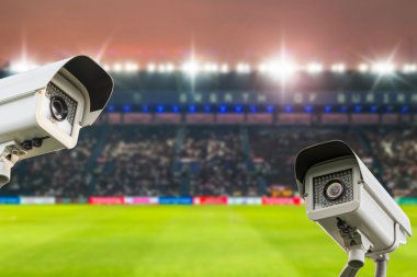 CCTV security in stadium football at twilight background. clipart
