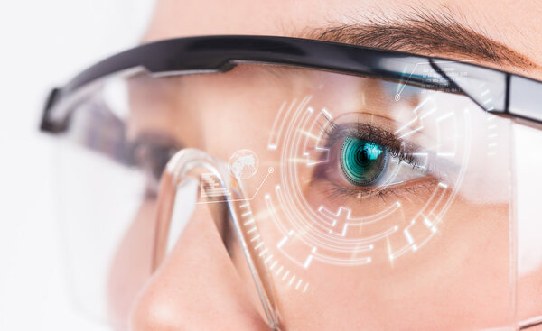 Close-up of woman's eye. High technologies in the futuristic.