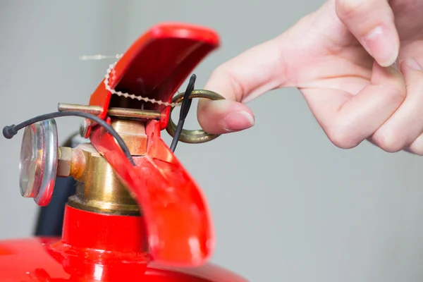 Close- up Fire extinguisher and pulling pin on red tank. — Stock Photo, Image
