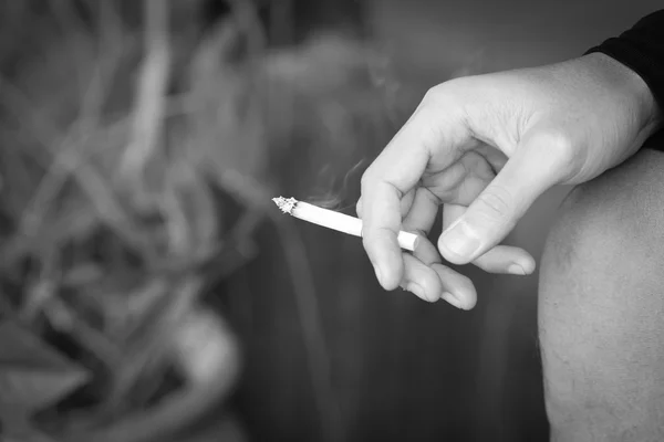 Close up hand holding cigarette. stop smoking — Stock Photo, Image