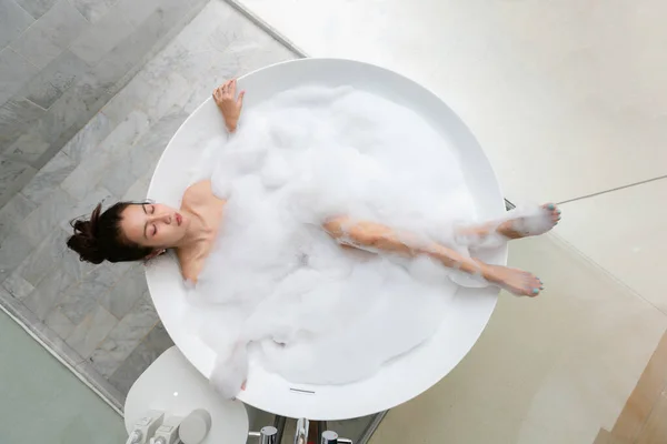 Asian Beautiful Young Woman Enjoying Pleasant Bath Foam Lying Closed Stock Image