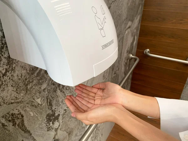 Man Hands Using Automatic Hand Dryer Public Toilet Restroom Hygiene Royalty Free Stock Images