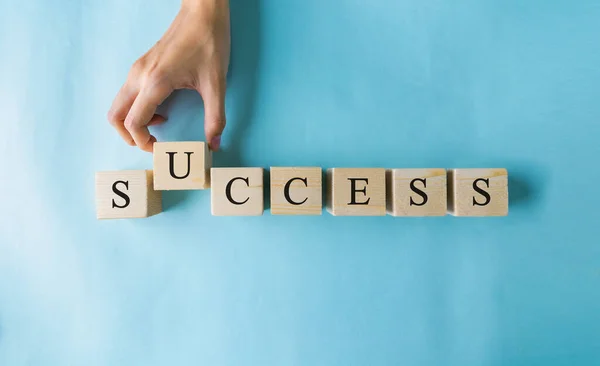 Hand Woman Holding Wooden Cubes Word Success — Stock Photo, Image