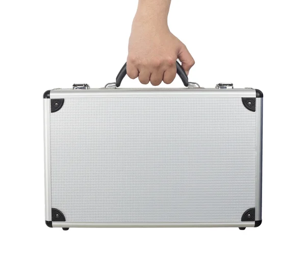 Рука и рука держа серебряный багаж или краткий случай изолированы на WH — стоковое фото