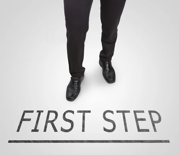 Businessman standing wearing court shoes on first step line. — Stock Photo, Image