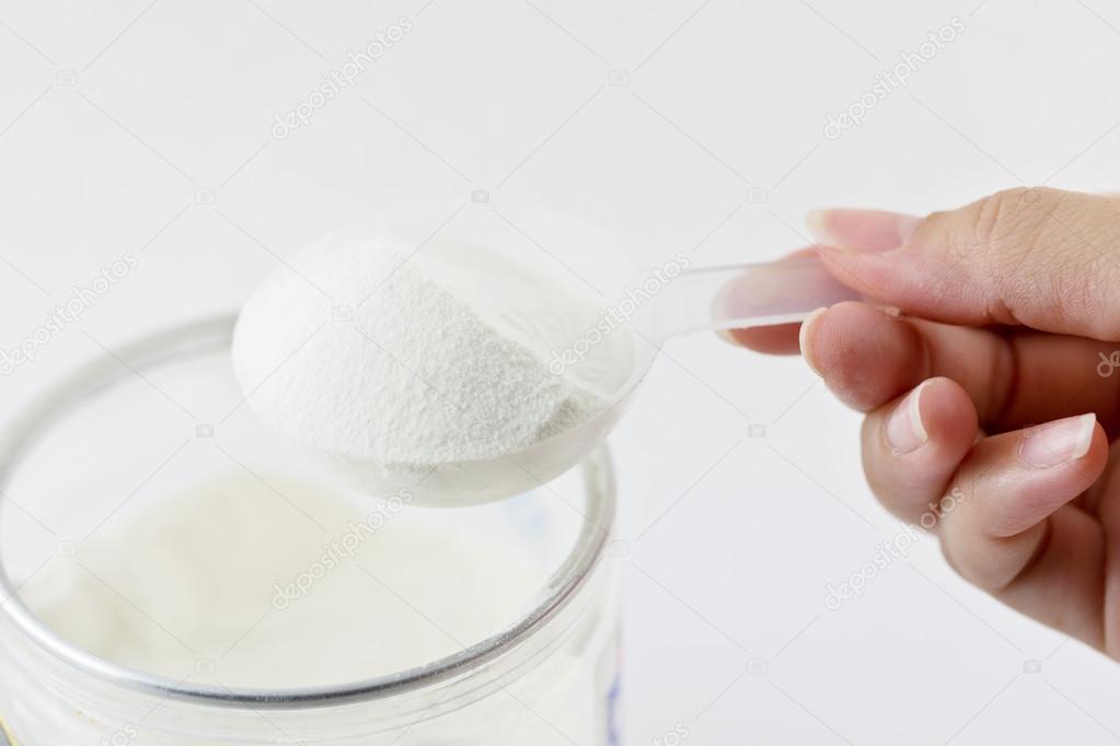Collagen protein powder on spoon measure isolate on white backgr
